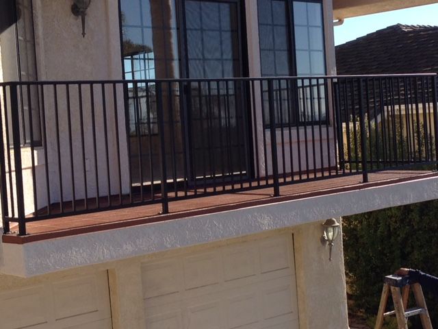 The final project of a deck repair/reconstruction complete with a brand new metal railing
